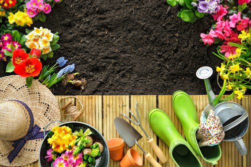Clearing weeds and branches during garden clearance in Barbican